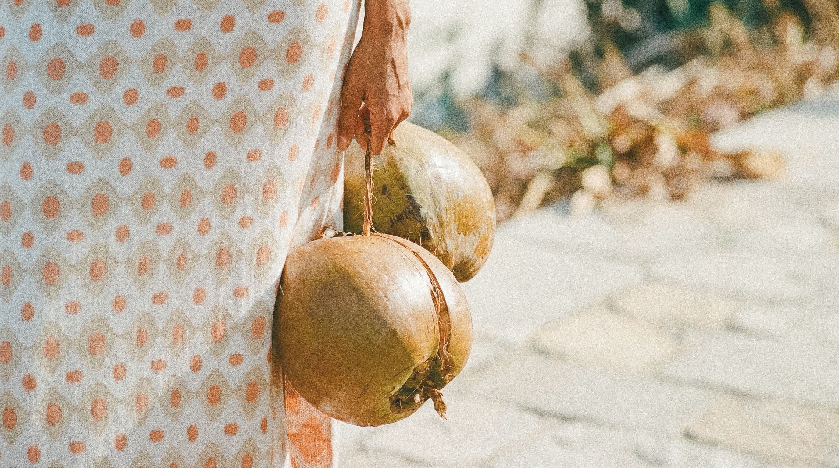 Coconuts carried along the street